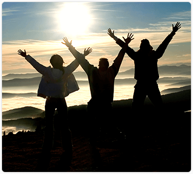 three men raising their ends on top of a mountain